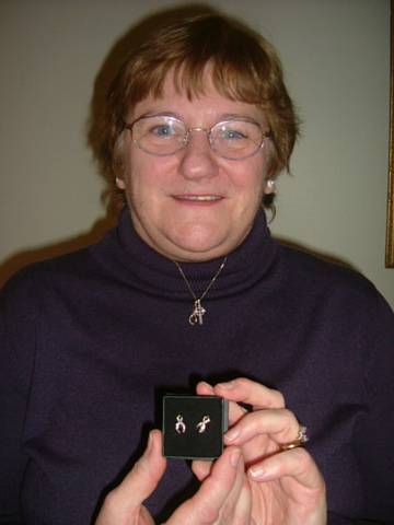Lynne displaying her earrings