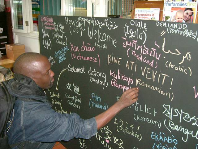 International students add 'welcome' in their own languages